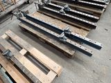 many pieces of wood that are sitting on the ground
