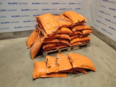 a pile of bags of sand sitting on a pallet