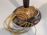 a lamp that is on top of a table with a cord