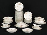 a lot of plates and cups on a black table