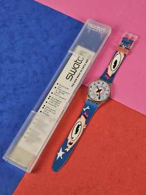 an image of a watch sitting on top of a blue and pink surface