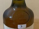 a bottle of wine that is sitting on a table