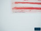 a picture of a red and white flag on a white wall