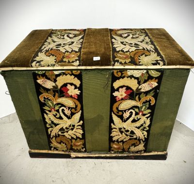 a green box with a floral design on it