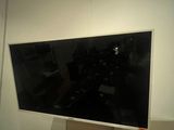 a television mounted on a wall in a room
