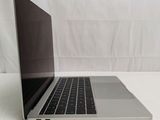 a laptop that is sitting on a white table