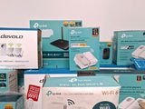 several boxes of different types of wireless devices on a table
