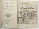 an open book with a map of a town on it