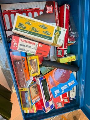 a blue box filled with books and other items