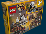 a box of legos with a pirate ship inside of it
