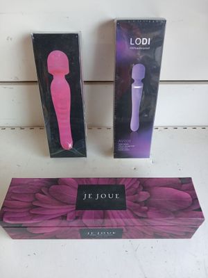 purple and black box with a pink handle and a black and white box with a pink handle and a purple and black box with a pink handle and black and white