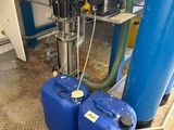 two blue barrels sitting next to each other on the floor