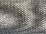 a close up of a piece of fabric on a blue surface