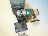 a bucket of water and a container of nuts on a table