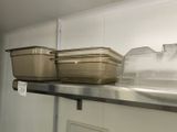three containers on the shelf in the kitchen