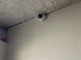 a camera mounted on the ceiling of a room