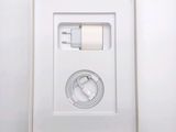 a white box with a charger and a cable in it