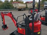 two small excavators that are parked next to each other