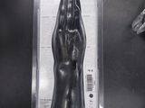 a black object in a plastic case on a table