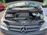 a car with its hood open and the engine in the trunk