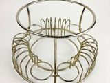 a metal basket with a wire basket on top of it