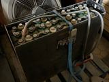 a cooler that has a bunch of beer bottles inside of it