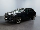 un SUV noir garé dans une pièce aux murs blancs