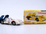 a small toy car next to a box of toys