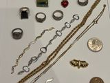 a lot of jewelry on display in a glass case