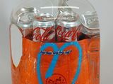 a glass jar filled with soda and a heart drawn on it