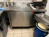 a kitchen with a sink, stove, and a dishwasher in it