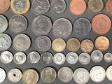 a lot of coins that are on the table
