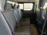 the back seats of a van are empty and the passenger seats are empty