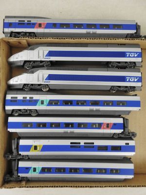a box full of toy trains sitting on a table
