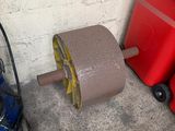 a red trash can and a roll of tape next to a red trash can