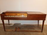 a piano that is sitting on top of a table