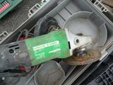 a green machine that is sitting inside of a box