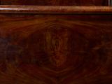 a wooden bed with a wooden headboard and foot board