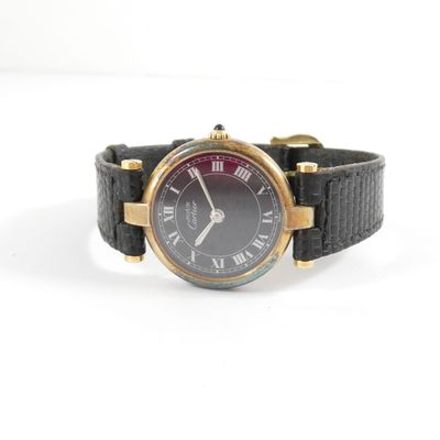 an image of a black and gold watch with roman numerals
