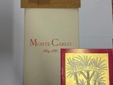 three books on a table with a picture of a palm tree