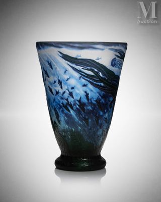 a glass vase with a blue and black design on it