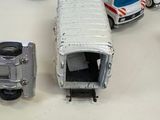 many toy ambulances and trucks on the table