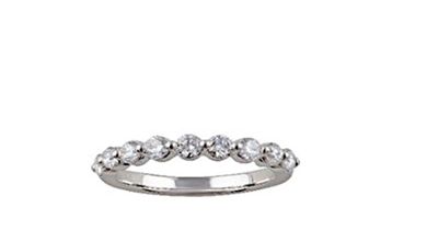 a close up of a diamond ring on a white background