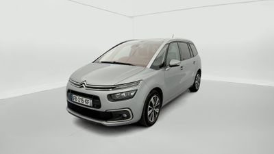 a silver citrole is parked in a white room