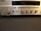 a silver radio that is sitting on a table