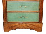 a small chest of drawers with three drawers on top of it