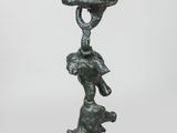 an image of a statue of a woman with a hat on her head