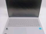 a silver laptop with a blue sticker on the screen