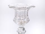 a glass vase that is sitting on top of a table