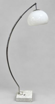 a white lamp on a marble base with a white shade